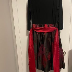 Long sleeve dress with A line skirt and big red bow